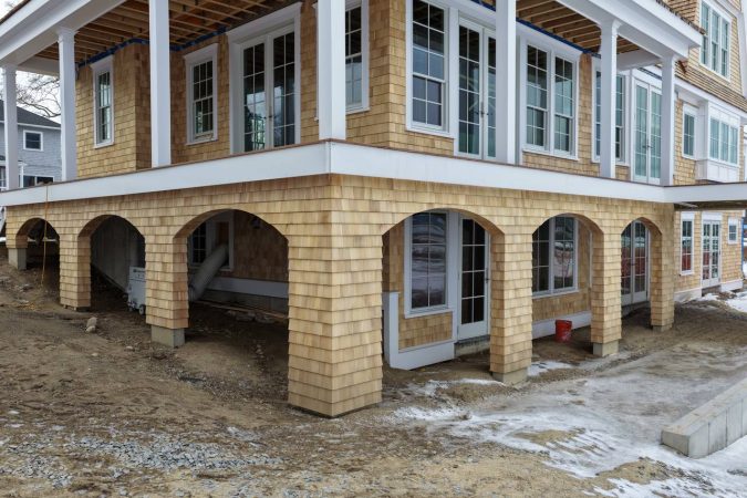 Plymouth coastal home with red cedar roof and white cedar siding